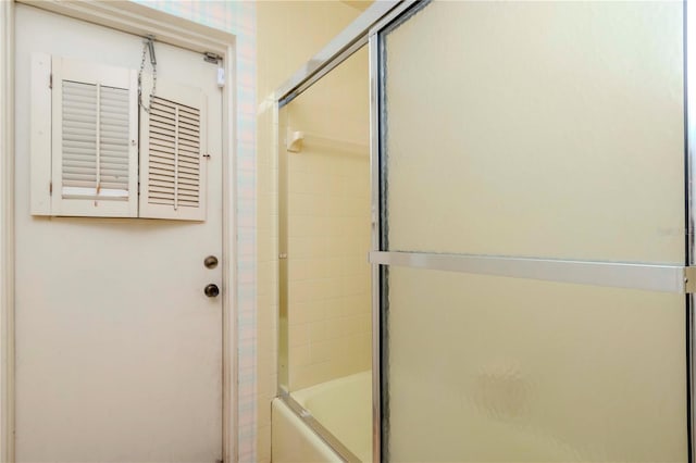 full bathroom featuring combined bath / shower with glass door