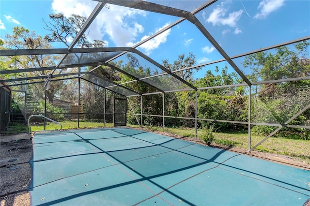 view of swimming pool with glass enclosure