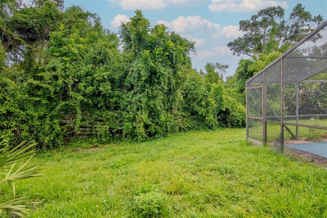 5101 Estates Cir, Sarasota, FL 34243 - view of yard featuring a lanai