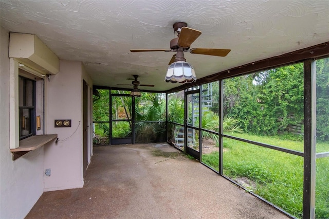 5101 Estates Cir, Sarasota, FL 34243 - unfurnished sunroom featuring a ceiling fan