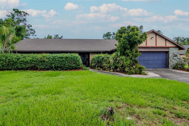 5101 Estates Cir, Sarasota, FL 34243 - view of front of property with concrete driveway, a front lawn, and an attached garage