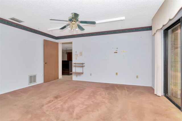 5101 Estates Cir, Sarasota, FL 34243 - empty room featuring light carpet, a textured ceiling, and a ceiling fan