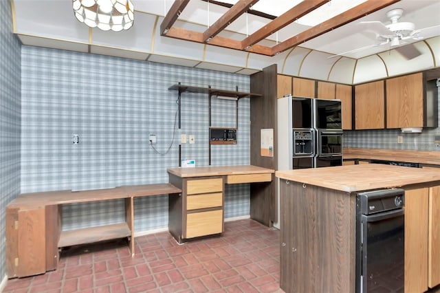 5101 Estates Cir, Sarasota, FL 34243 - kitchen featuring wood counters, wallpapered walls, brick patterned flooring, black fridge, and a ceiling fan