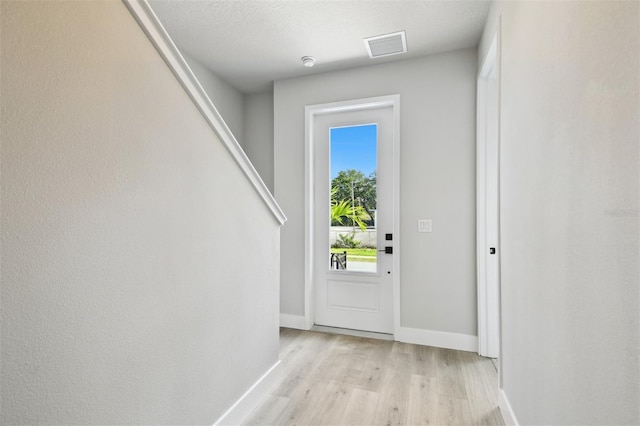4717 W Mccoy St Unit 9, Tampa, FL 33616 - entryway featuring light wood-type flooring and baseboards