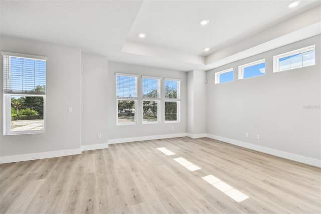 4717 W Mccoy St Unit 9, Tampa, FL 33616 - empty room with recessed lighting, light wood-style floors, a raised ceiling, and baseboards