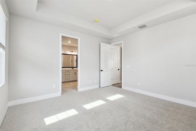 4717 W Mccoy St Unit 9, Tampa, FL 33616 - unfurnished bedroom featuring light colored carpet, baseboards, connected bathroom, and recessed lighting