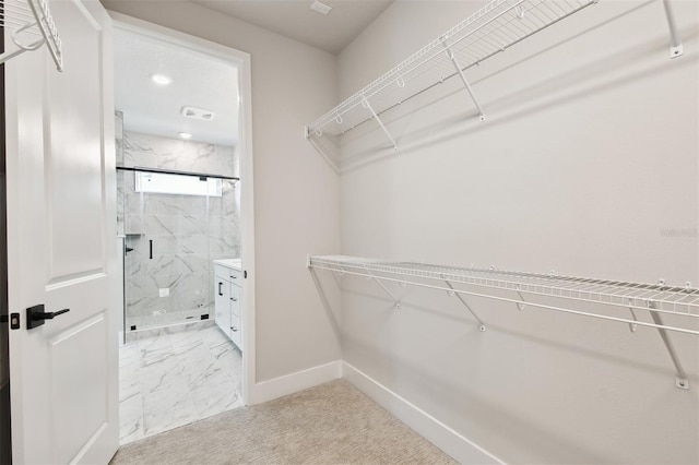 4717 W Mccoy St Unit 9, Tampa, FL 33616 - spacious closet featuring light marble finish floors