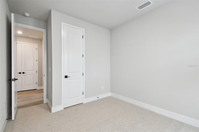 4717 W Mccoy St Unit 9, Tampa, FL 33616 - unfurnished bedroom featuring light colored carpet and baseboards