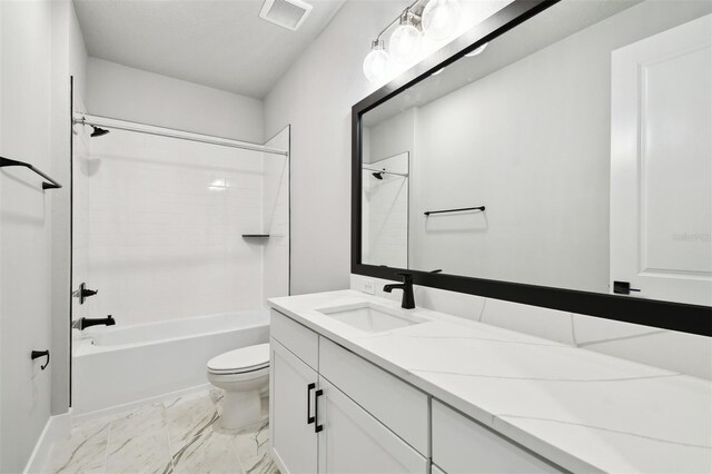 4717 W Mccoy St Unit 9, Tampa, FL 33616 - bathroom with toilet, vanity, marble look tile flooring, shower / bathtub combination, and baseboards