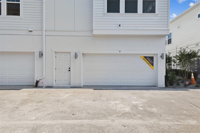 4717 W Mccoy St Unit 9, Tampa, FL 33616 - garage with driveway