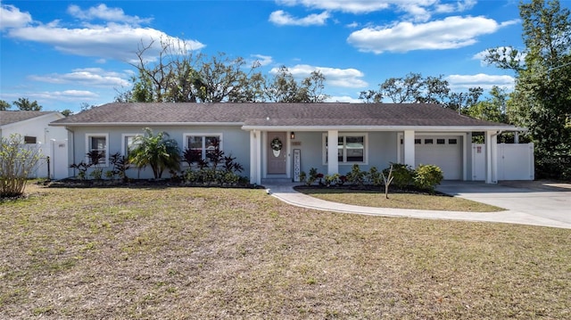 ranch-style home with a garage, concrete driveway, fence, and stucco siding