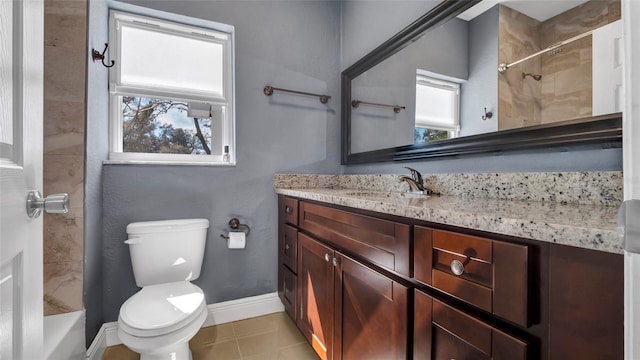 bathroom featuring toilet, baseboards, and vanity