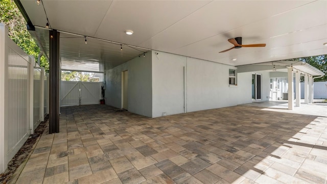 view of patio featuring ceiling fan, a gate, and fence