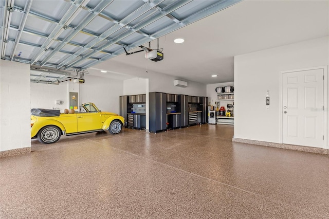 garage featuring electric panel, recessed lighting, a wall mounted air conditioner, and a garage door opener