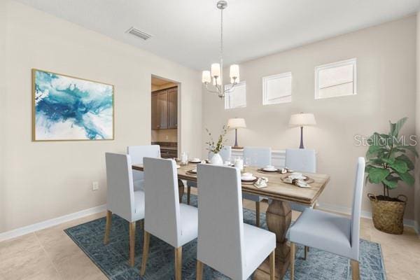 dining area with a chandelier, visible vents, and baseboards