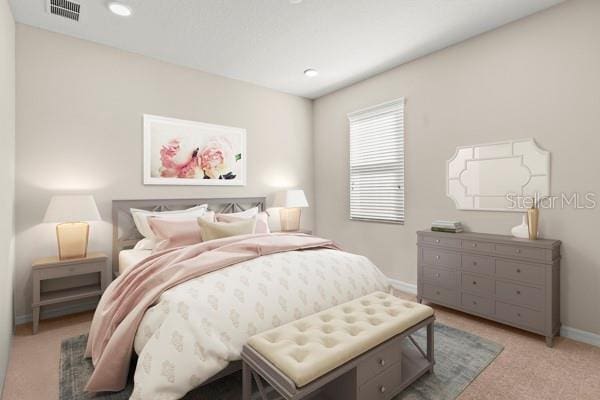 bedroom with light colored carpet, visible vents, baseboards, and recessed lighting