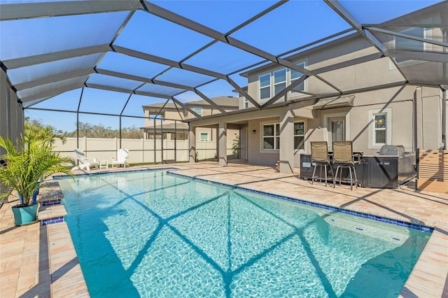 view of swimming pool featuring a patio area, fence, a fenced in pool, and a lanai