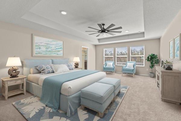 bedroom featuring a textured ceiling, light carpet, a ceiling fan, baseboards, and a raised ceiling