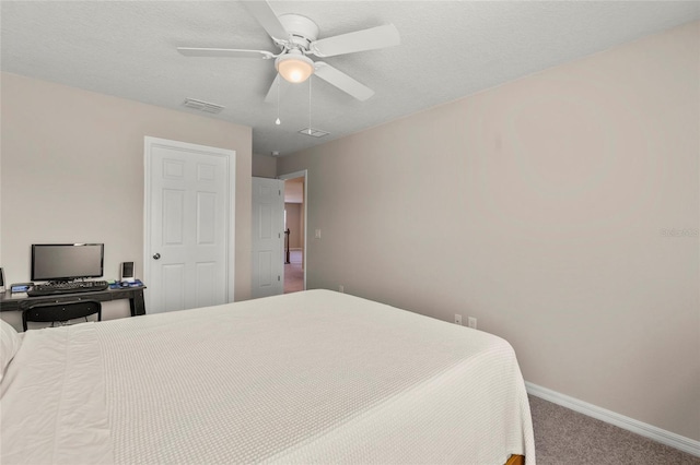 bedroom featuring a textured ceiling, a ceiling fan, visible vents, baseboards, and carpet