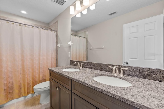 full bath with toilet, a sink, and visible vents