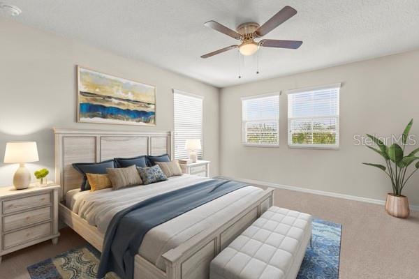 bedroom with ceiling fan, a textured ceiling, carpet, and baseboards