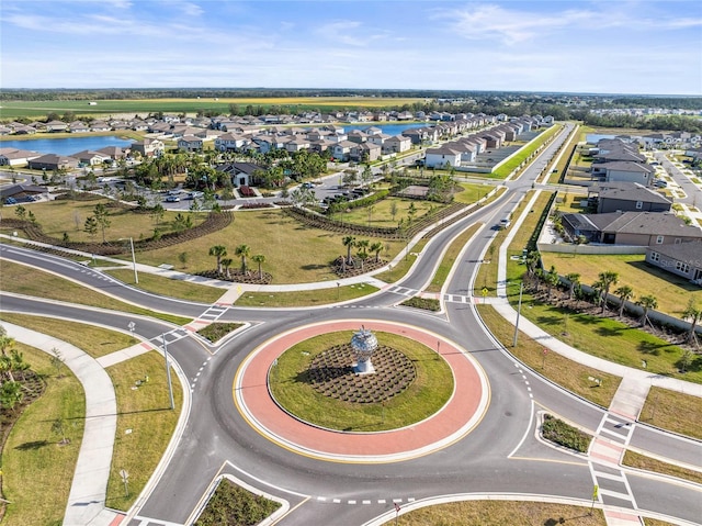 birds eye view of property with a water view and a residential view