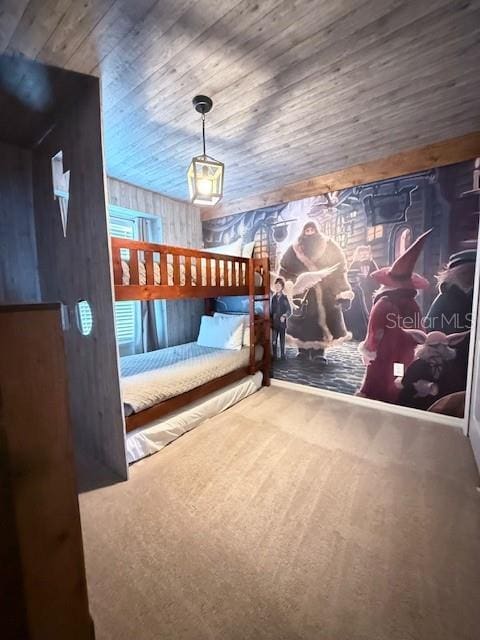 interior space featuring wooden ceiling and carpet