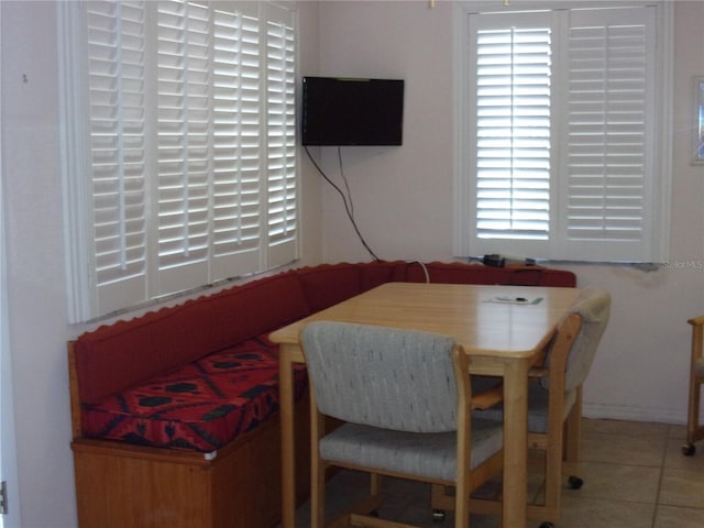 dining area with tile patterned flooring