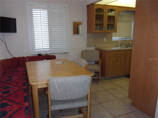 dining area featuring light tile patterned flooring