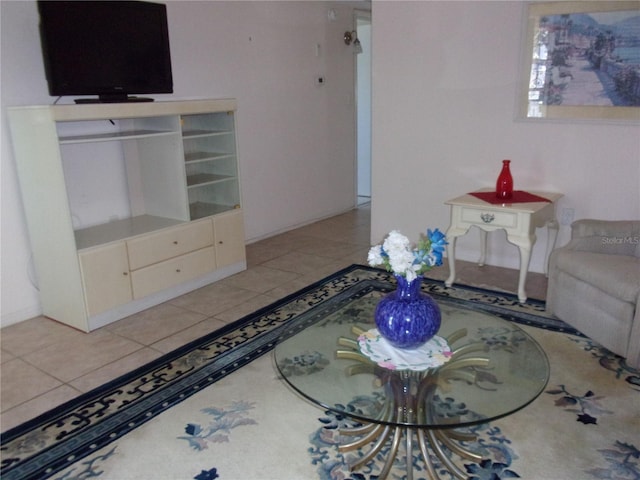 unfurnished living room featuring tile patterned floors