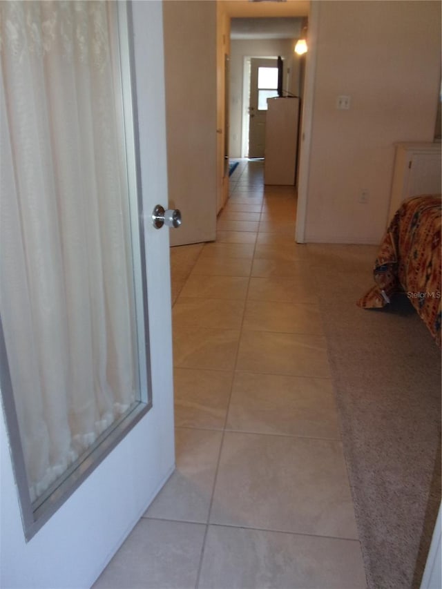 hallway with light tile patterned flooring