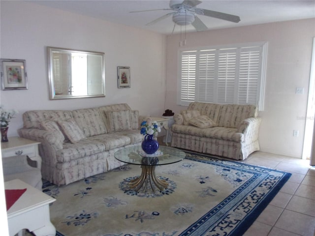 tiled living area with a ceiling fan