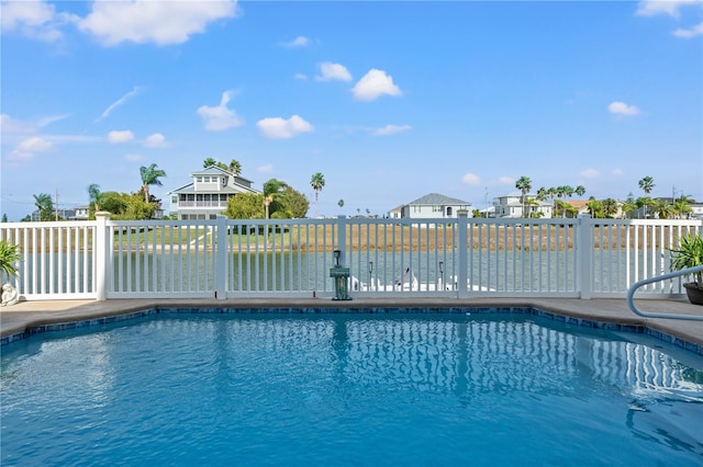 view of swimming pool featuring fence and a fenced in pool