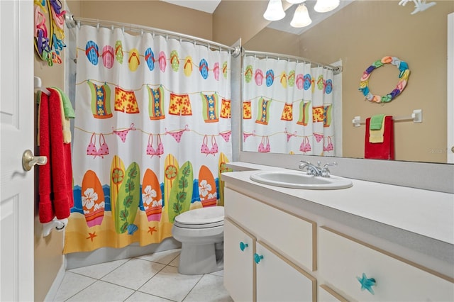 full bathroom with tile patterned flooring, vanity, toilet, and shower / bath combo with shower curtain