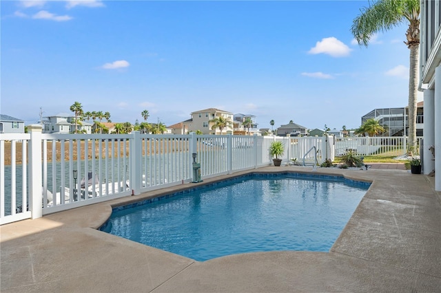 view of pool featuring a patio, fence, a residential view, and a fenced in pool