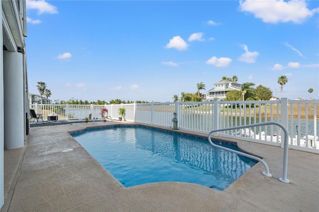 view of swimming pool featuring fence, a fenced in pool, and a patio