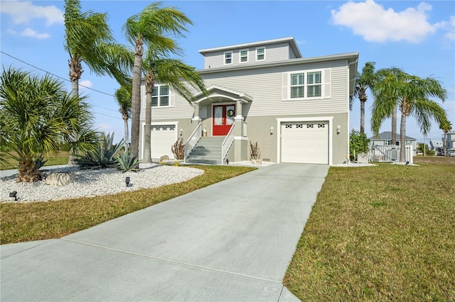 view of front of house featuring a garage, concrete driveway, a front lawn, and stucco siding