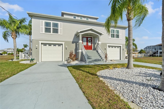 view of front of house featuring a garage, concrete driveway, french doors, and a front yard