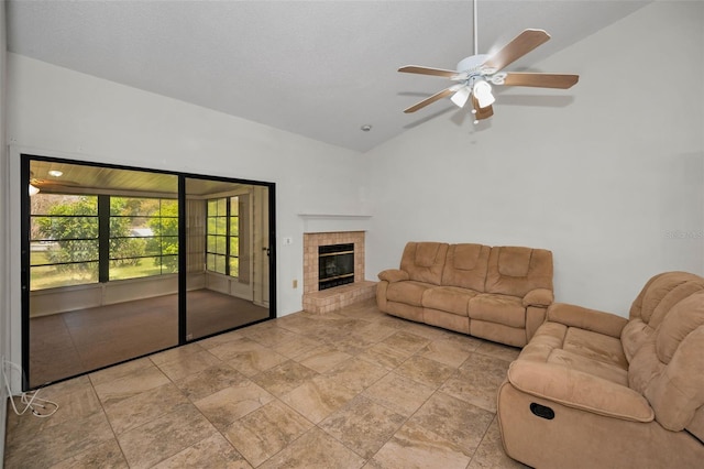 2446 Bentley Dr, Palm Harbor, FL 34684 - unfurnished living room with lofted ceiling, ceiling fan, and a tiled fireplace
