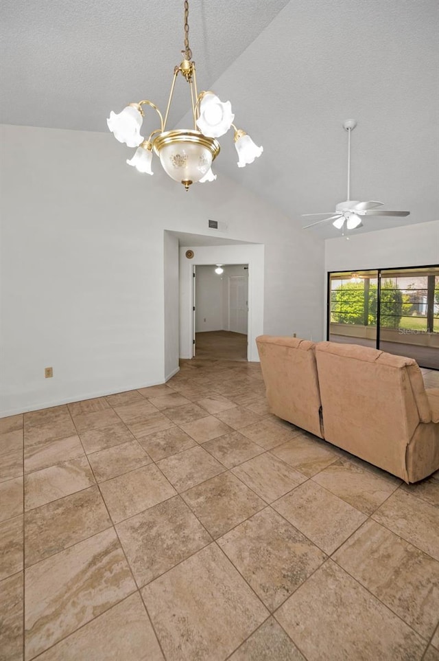 2446 Bentley Dr, Palm Harbor, FL 34684 - unfurnished living room featuring a textured ceiling, ceiling fan with notable chandelier, vaulted ceiling, and visible vents