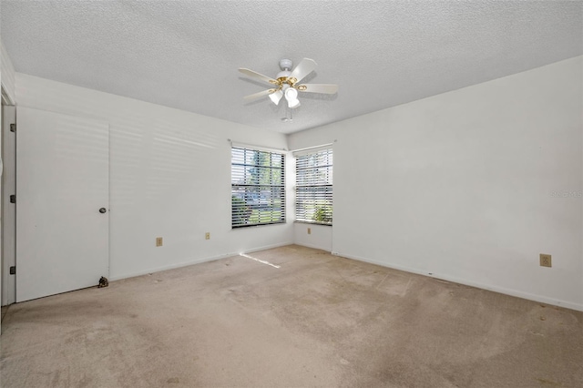 2446 Bentley Dr, Palm Harbor, FL 34684 - unfurnished room with a textured ceiling, light colored carpet, and ceiling fan