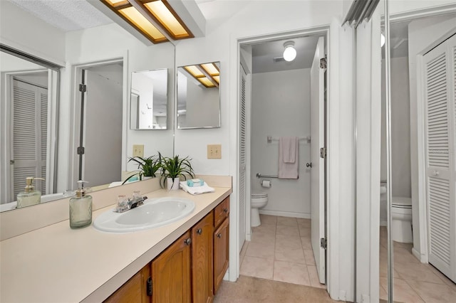 2446 Bentley Dr, Palm Harbor, FL 34684 - bathroom with a closet, toilet, tile patterned flooring, and vanity
