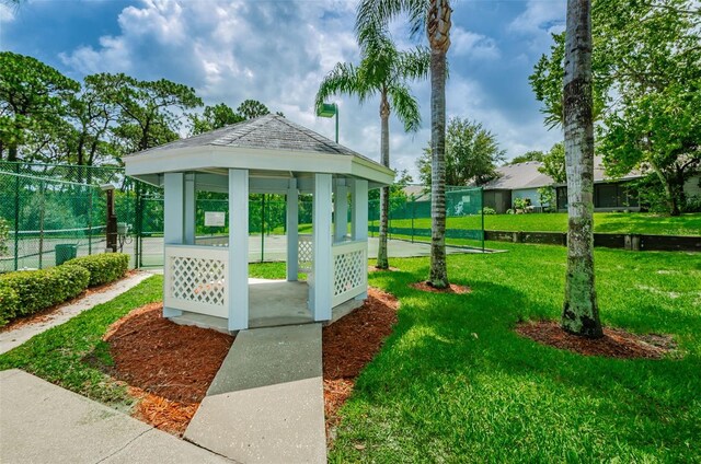 2446 Bentley Dr, Palm Harbor, FL 34684 - view of community with fence, a gazebo, and a yard