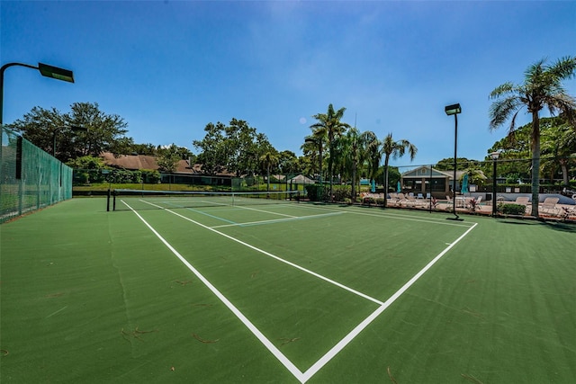 2446 Bentley Dr, Palm Harbor, FL 34684 - view of tennis court featuring fence
