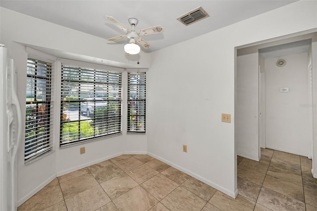 2446 Bentley Dr, Palm Harbor, FL 34684 - empty room with baseboards, visible vents, and a ceiling fan