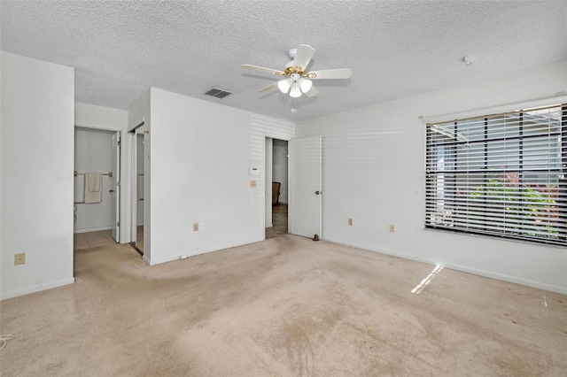 2446 Bentley Dr, Palm Harbor, FL 34684 - unfurnished bedroom featuring a textured ceiling, visible vents, baseboards, a ceiling fan, and carpet floors