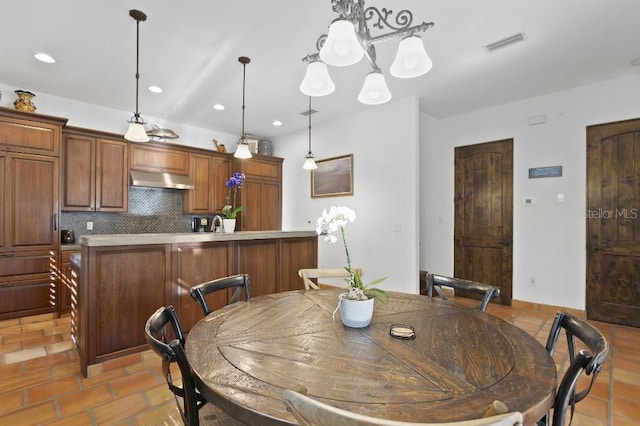 dining room with recessed lighting and visible vents