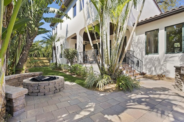 view of patio with an outdoor fire pit