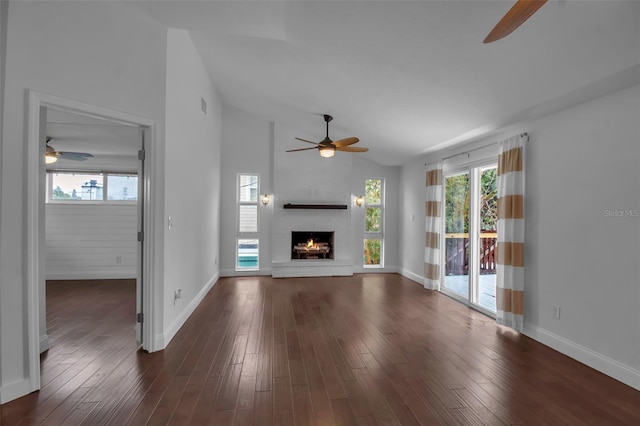 7 Georgia Ave, Crystal Beach, FL 34681 - unfurnished living room with dark wood-style floors, lofted ceiling, and a ceiling fan