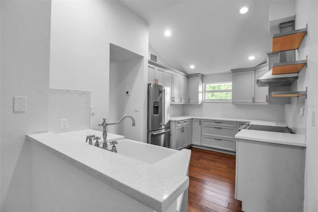7 Georgia Ave, Crystal Beach, FL 34681 - kitchen featuring a sink, stainless steel fridge, tasteful backsplash, and gray cabinets